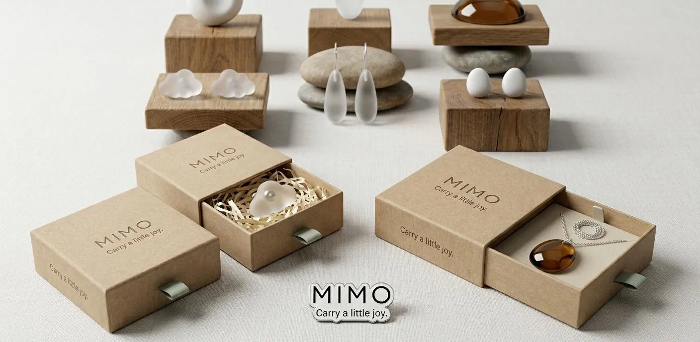 MIMO Brand Moodboard showing natural kraft boxes, frosted glass cloud accessories, amber pendant, and smooth pebbles.